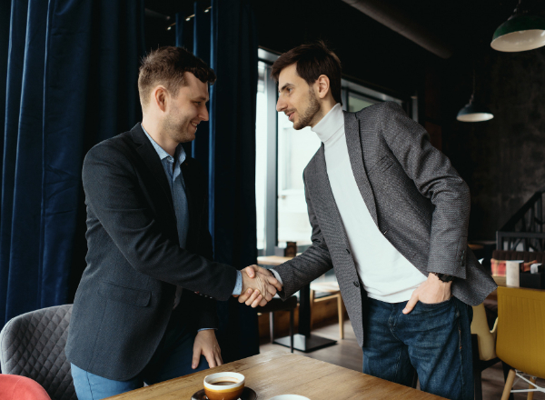 Business partners shaking hands for a franchise partnership